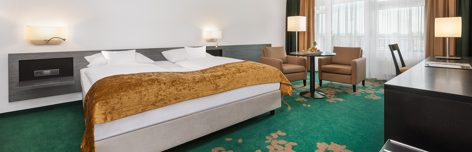Bett im Economy Zimmer in den SI-SUITES in Stuttgart
